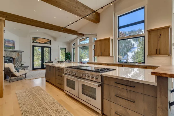 a kitchen with stainless steel appliances granite countertop a stove and a sink