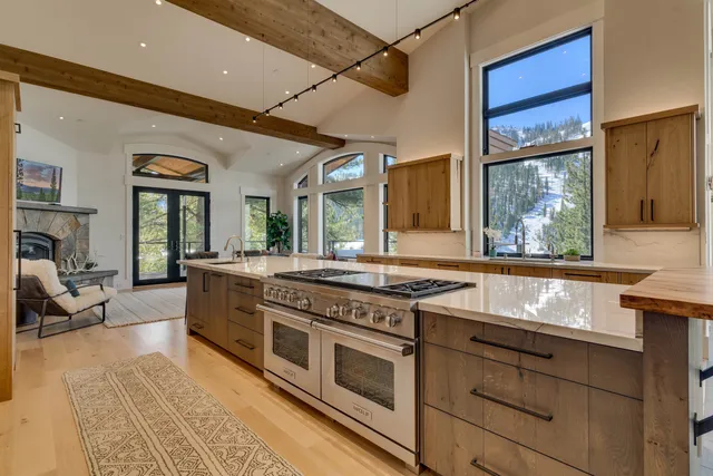 a kitchen with stainless steel appliances granite countertop a stove and a sink