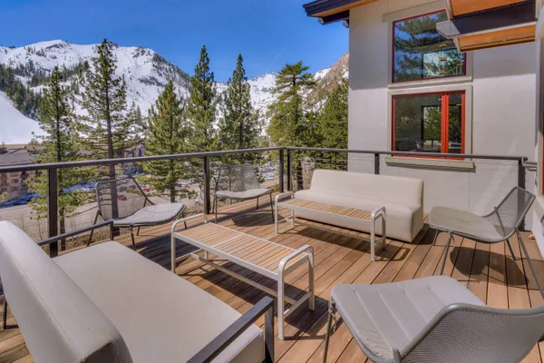 a view of a patio with iron fence