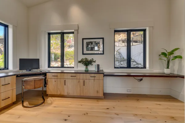 a kitchen with a sink cabinets and window