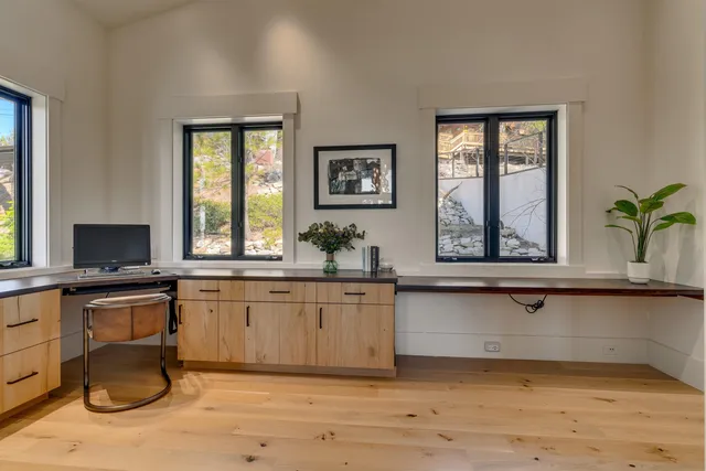 a kitchen with a sink cabinets and window