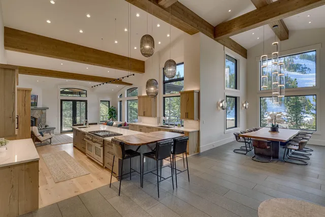 a kitchen with a table and chairs in it