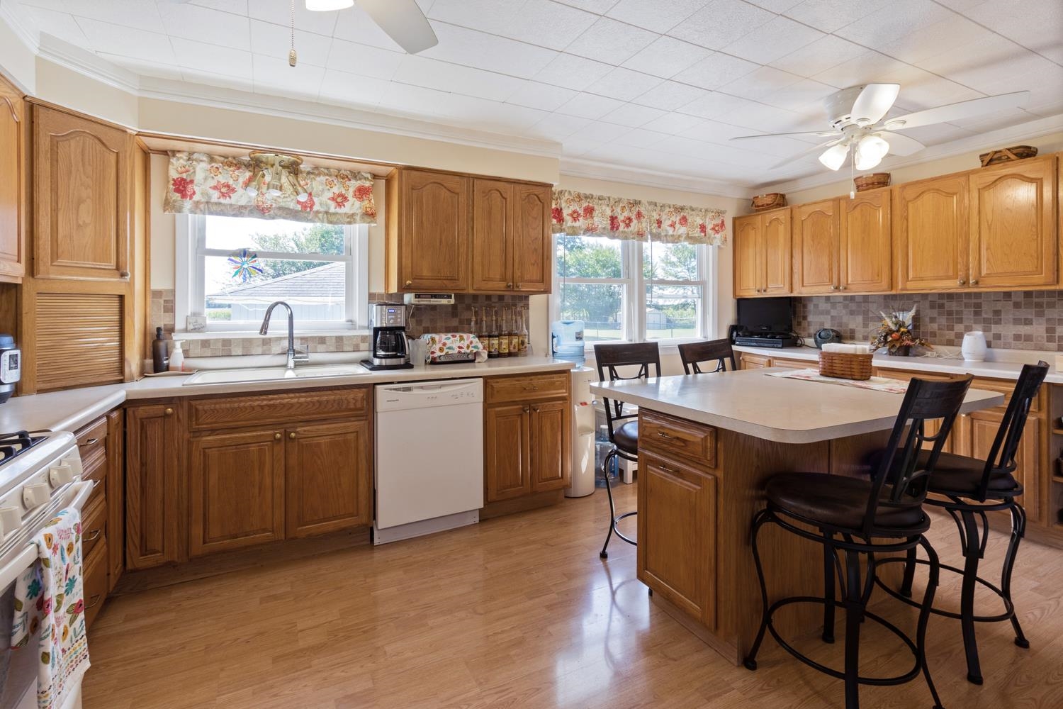1639 Us Rt 52 Dixon, IL 61021 - Photo 12 of 31 a kitchen a sink a window and chairs
