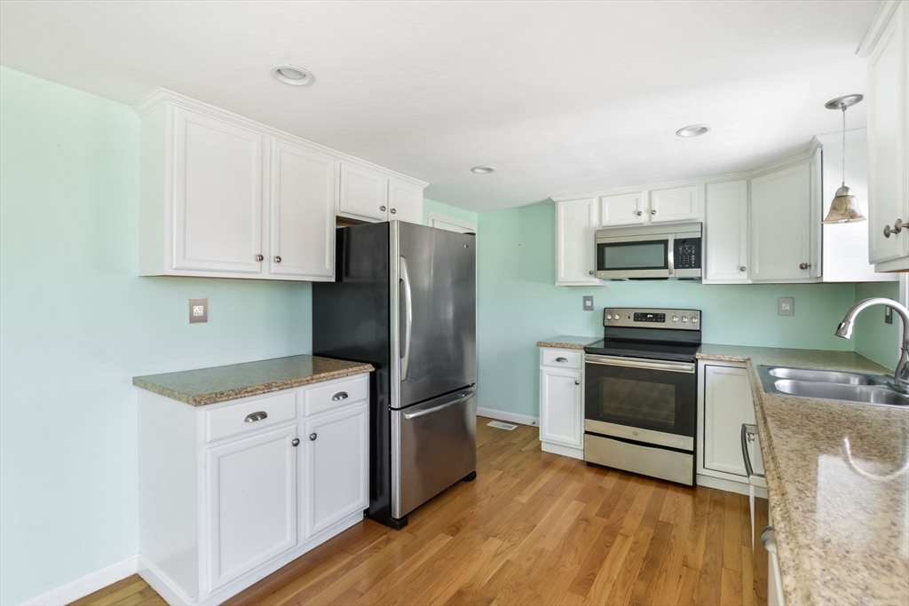 48 Kennedy Circle Barnstable, MA 02601 - Photo 15 of 32 a kitchen with stainless steel appliances a stove microwave and a refrigerator