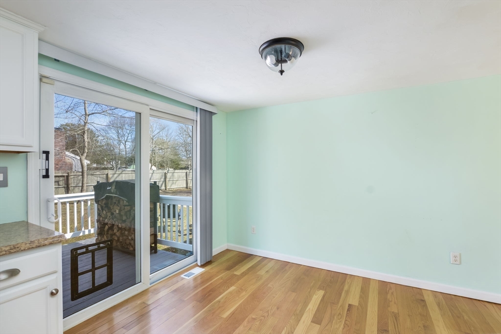 48 Kennedy Circle Barnstable, MA 02601 - Photo 16 of 32 a view of a livingroom with wooden floor and a large window