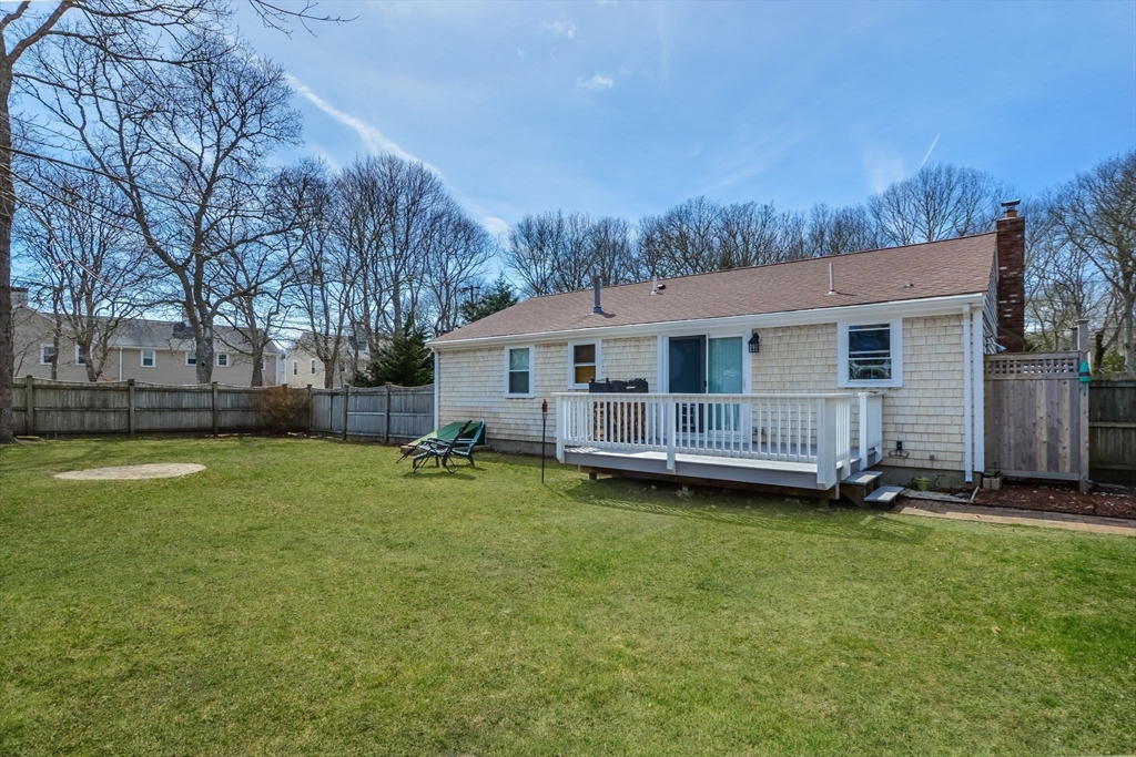 48 Kennedy Circle Barnstable, MA 02601 - Photo 29 of 32 a view of a house with backyard and trees