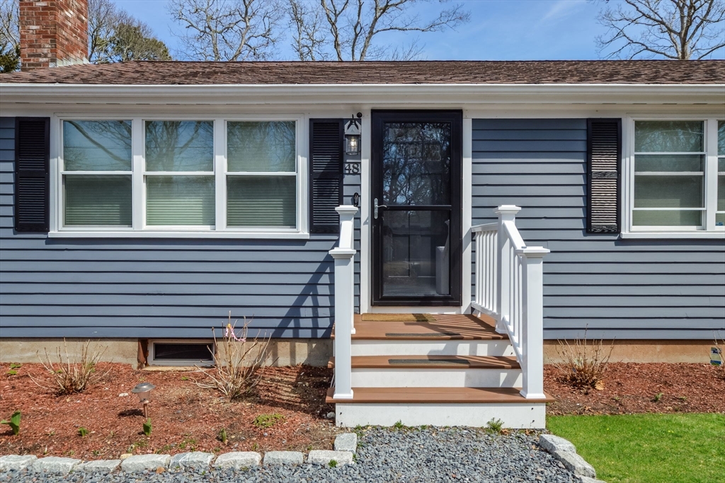 48 Kennedy Circle Barnstable, MA 02601 - Photo 3 of 32 a front view of a house with a window and a rug