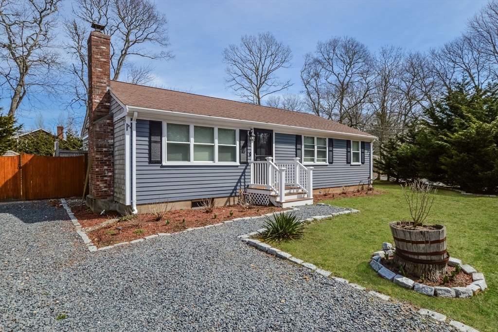 48 Kennedy Circle Barnstable, MA 02601 - Photo 31 of 32 front view of a house with a yard