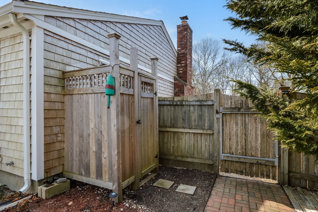 48 Kennedy Circle Barnstable, MA 02601 - Photo 5 of 32 a view of a wooden door with a tree