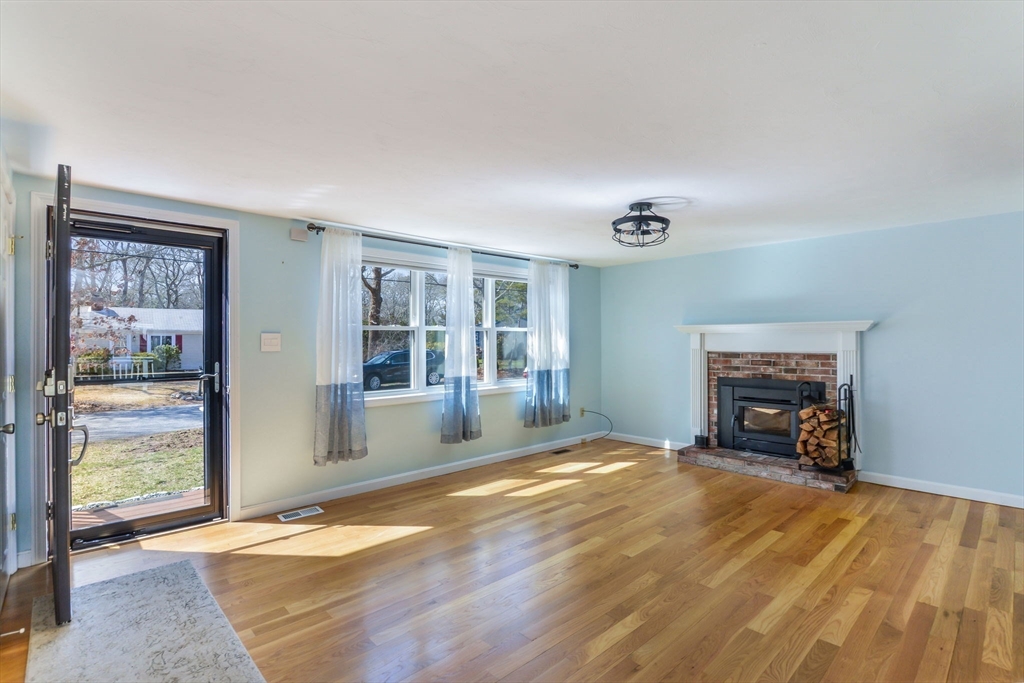 48 Kennedy Circle Barnstable, MA 02601 - Photo 7 of 32 a view of an empty room with a window and fireplace