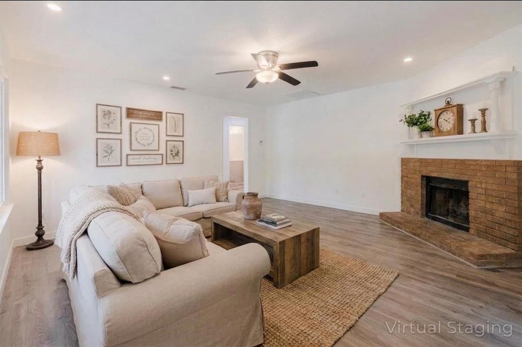 524 West Roberts Street Gorman, TX 76454 - Photo 5 of 35 a living room with furniture and a fireplace