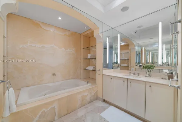 a bathroom with a bathtub and a sink