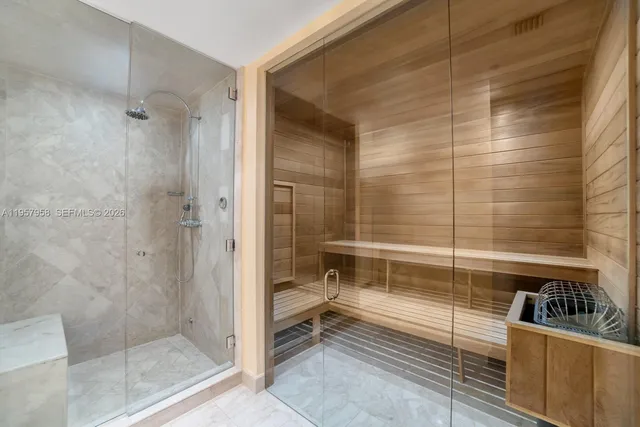 a bathroom with a shower and a sink