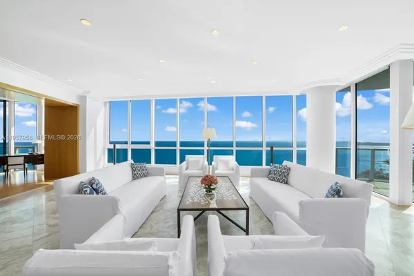 a living room with furniture and a large window