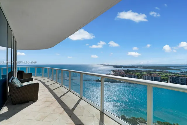 a view of a balcony with furniture