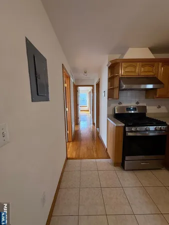 a kitchen with a stove and a refrigerator