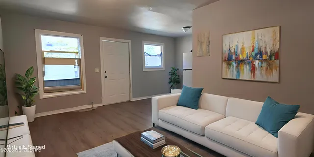 a living room with furniture and window