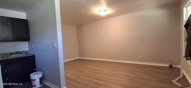 a view of bathroom with toilet a sink and a mirror