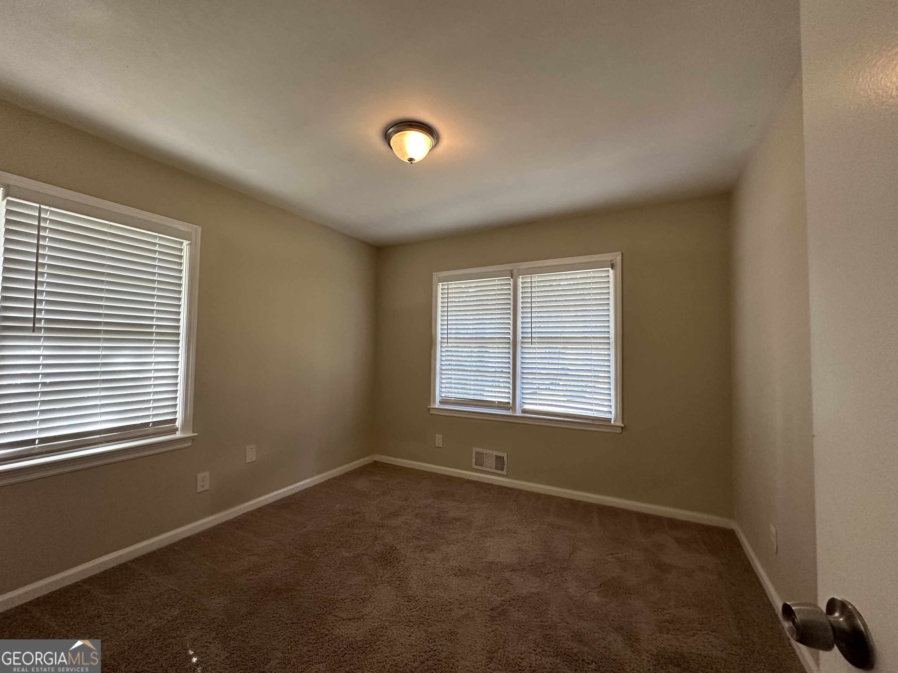 1581 Hollyhock Terrace Decatur, GA 30032 - Photo 11 of 12 an empty room with a window