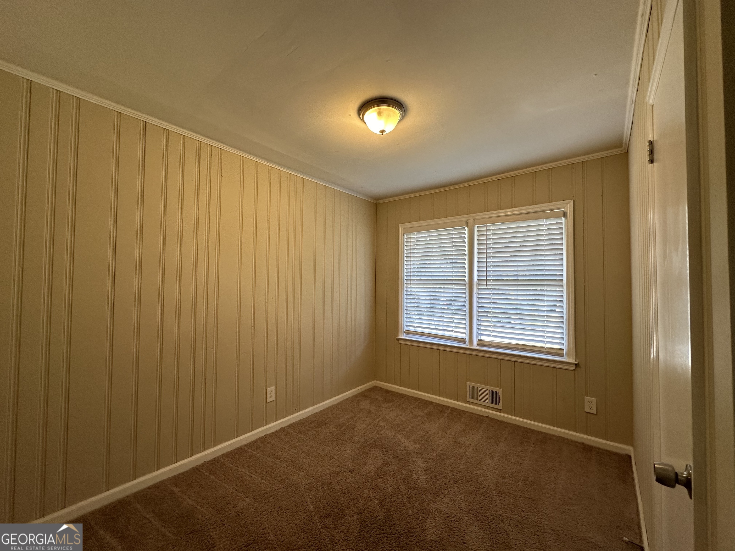 1581 Hollyhock Terrace Decatur, GA 30032 - Photo 12 of 12 a view of an empty room with a window