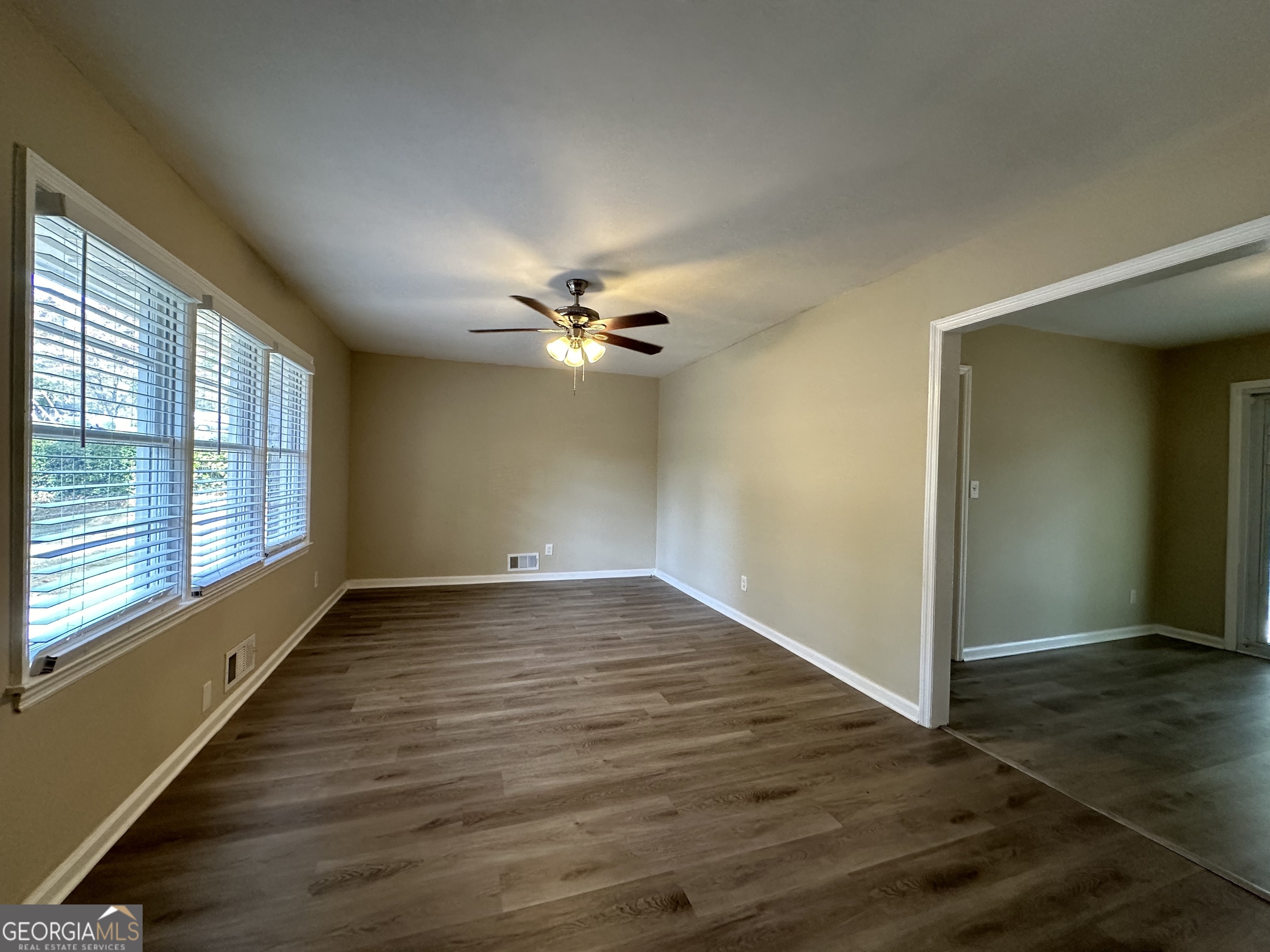 1581 Hollyhock Terrace Decatur, GA 30032 - Photo 3 of 12 wooden floor in an empty room with a window