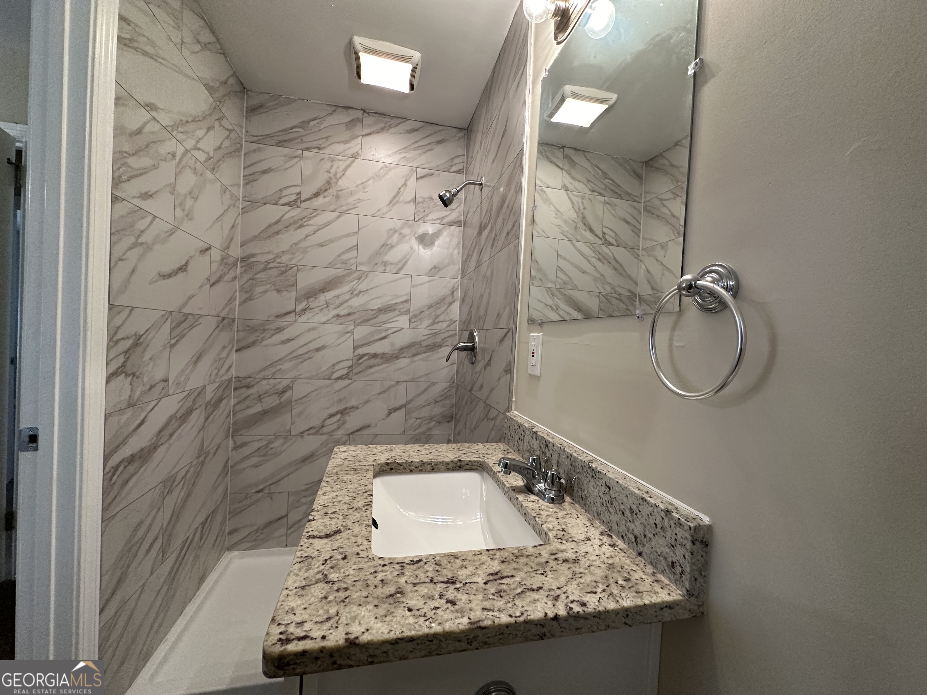 1581 Hollyhock Terrace Decatur, GA 30032 - Photo 10 of 12 a bathroom with a granite countertop sink a toilet and shower