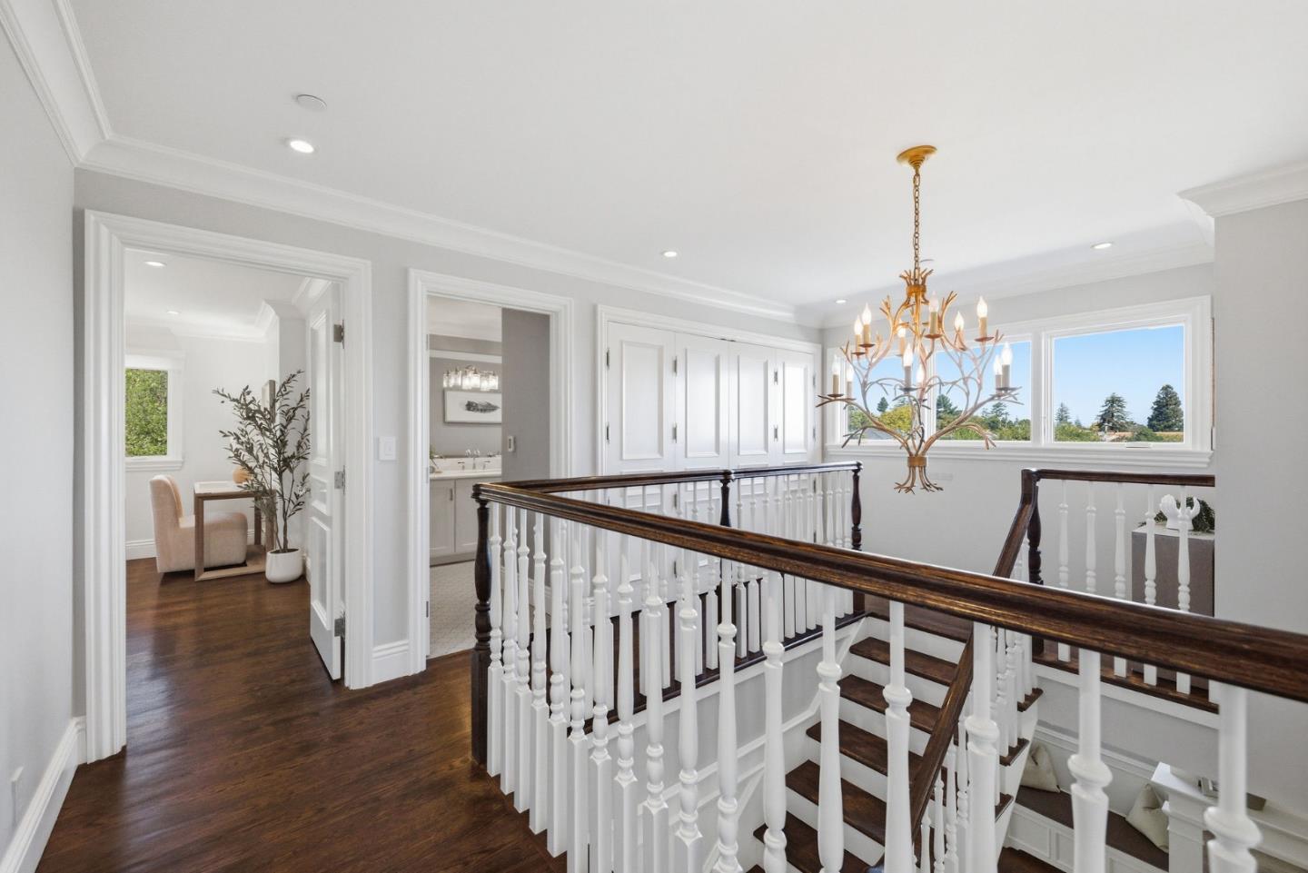 638 Oregon Avenue San Mateo, CA 94402 - Photo 15 of 34 a view of a hallway with wooden floor and stairs