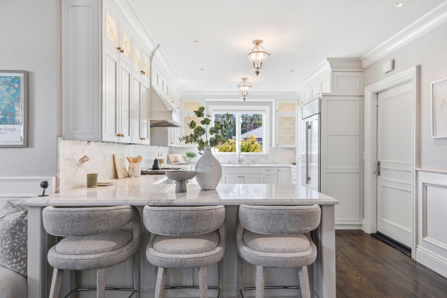 638 Oregon Avenue San Mateo, CA 94402 - Photo 8 of 34 a kitchen with a dining table chairs and sink