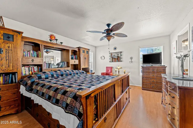 a bedroom with furniture and flat screen tv