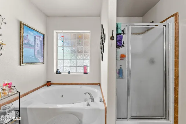 a bathroom with a bathtub and a shower
