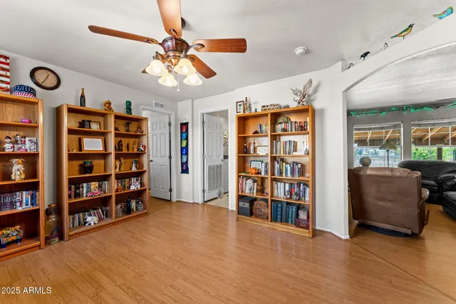 a view of a livingroom with furniture and staircase