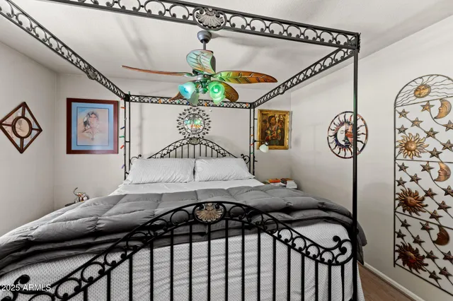 a bedroom with a bed and a table in it