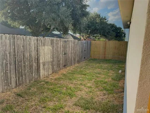 a view of outdoor space with wooden fence