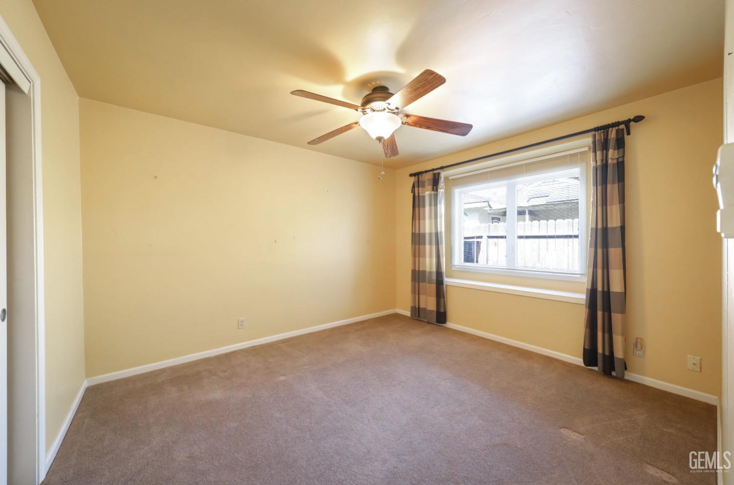 Undisclosed Address Bakersfield, CA 93305 - Photo 17 of 33 a view of an empty room with a window