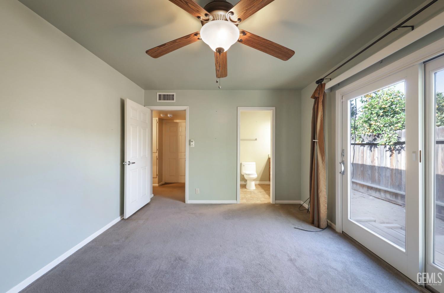 Undisclosed Address Bakersfield, CA 93305 - Photo 20 of 33 a view of empty room with wooden floor and fan