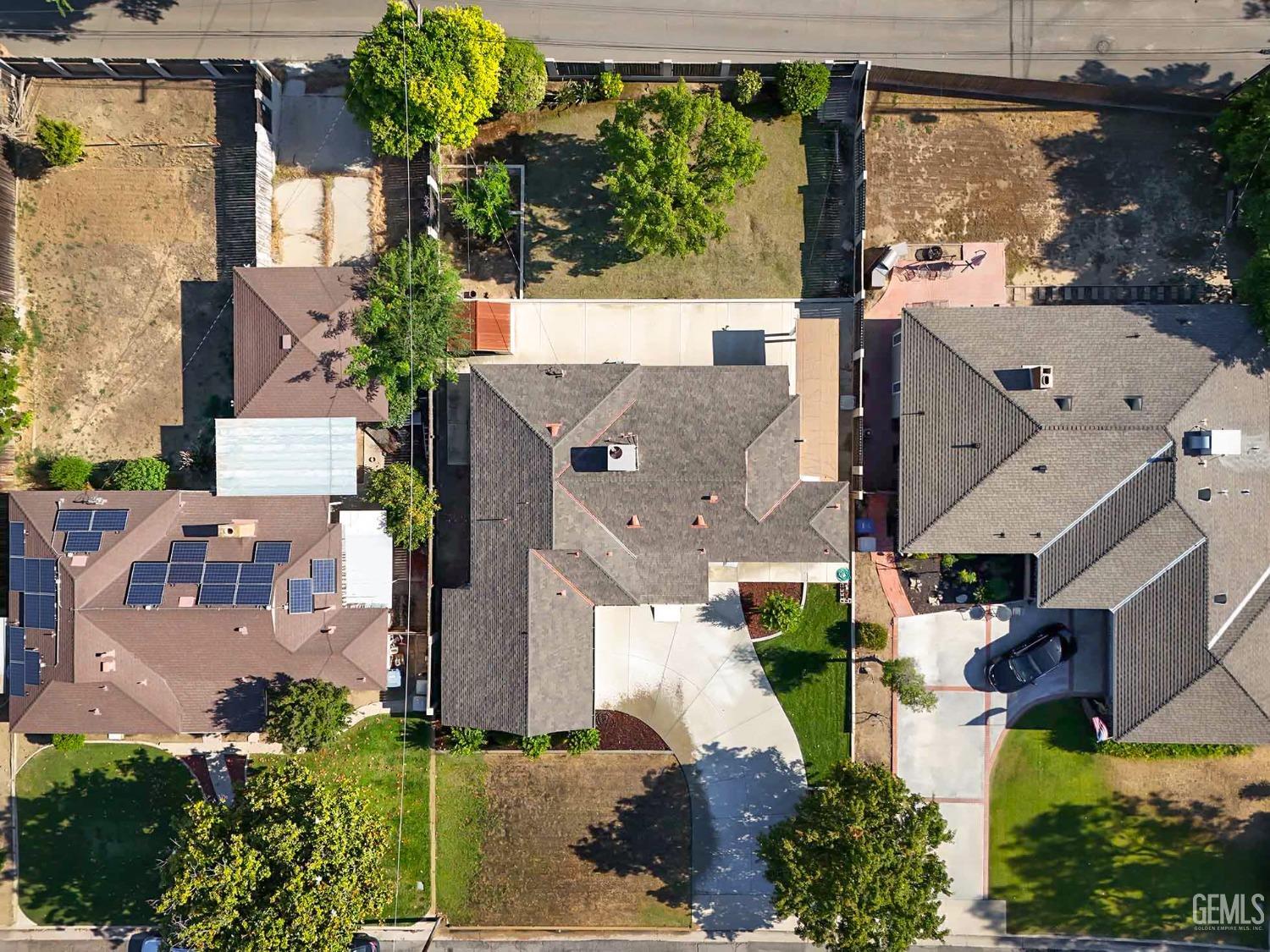 Undisclosed Address Bakersfield, CA 93305 - Photo 2 of 33 an aerial view of multiple houses with yard