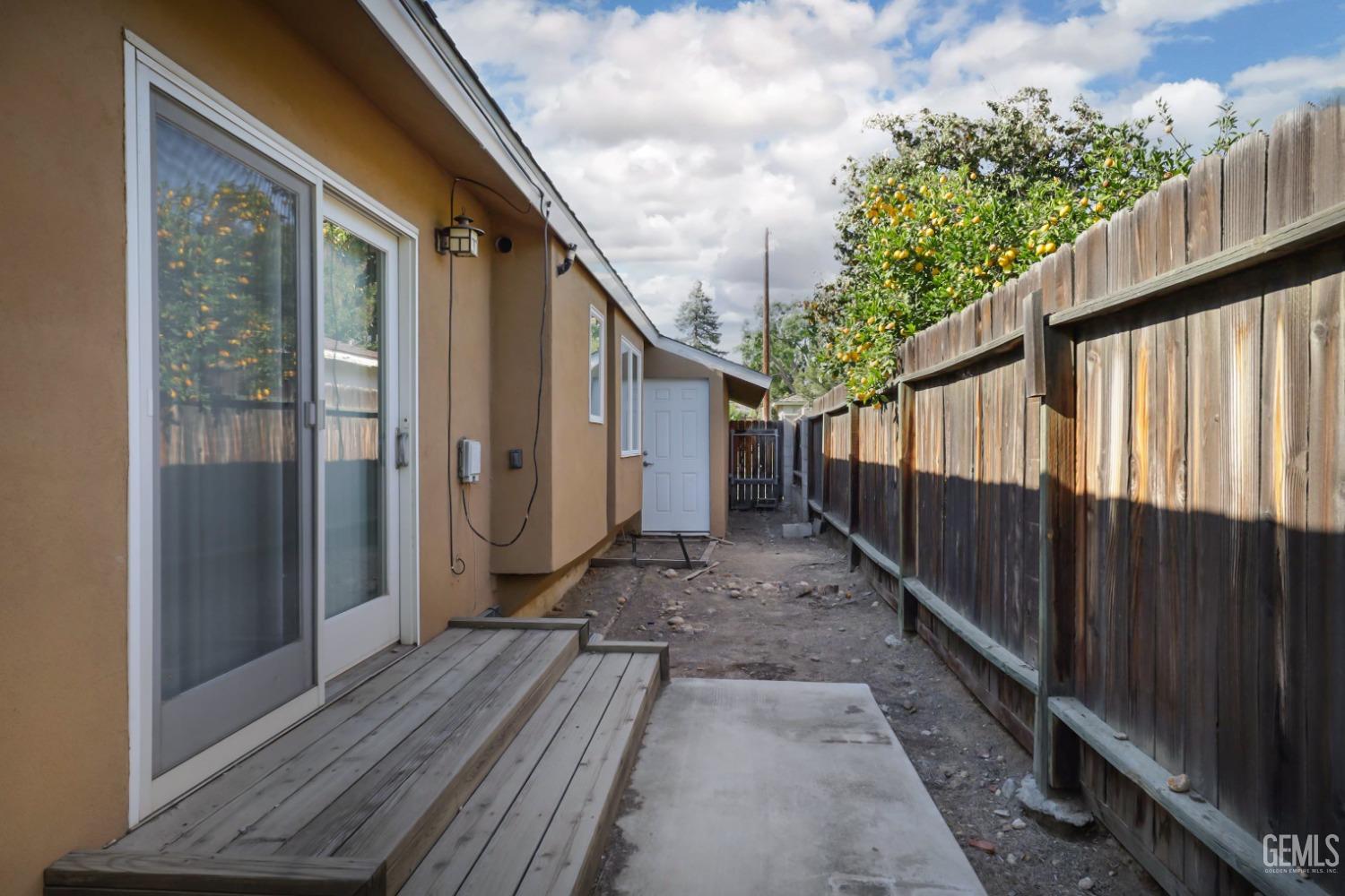 Undisclosed Address Bakersfield, CA 93305 - Photo 26 of 33 a view of a house with a backyard