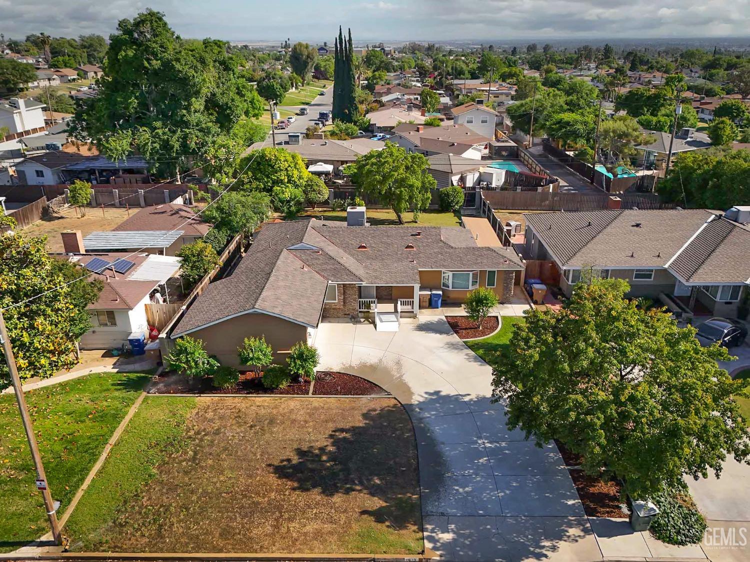 Undisclosed Address Bakersfield, CA 93305 - Photo 30 of 33 an aerial view of multiple houses with yard