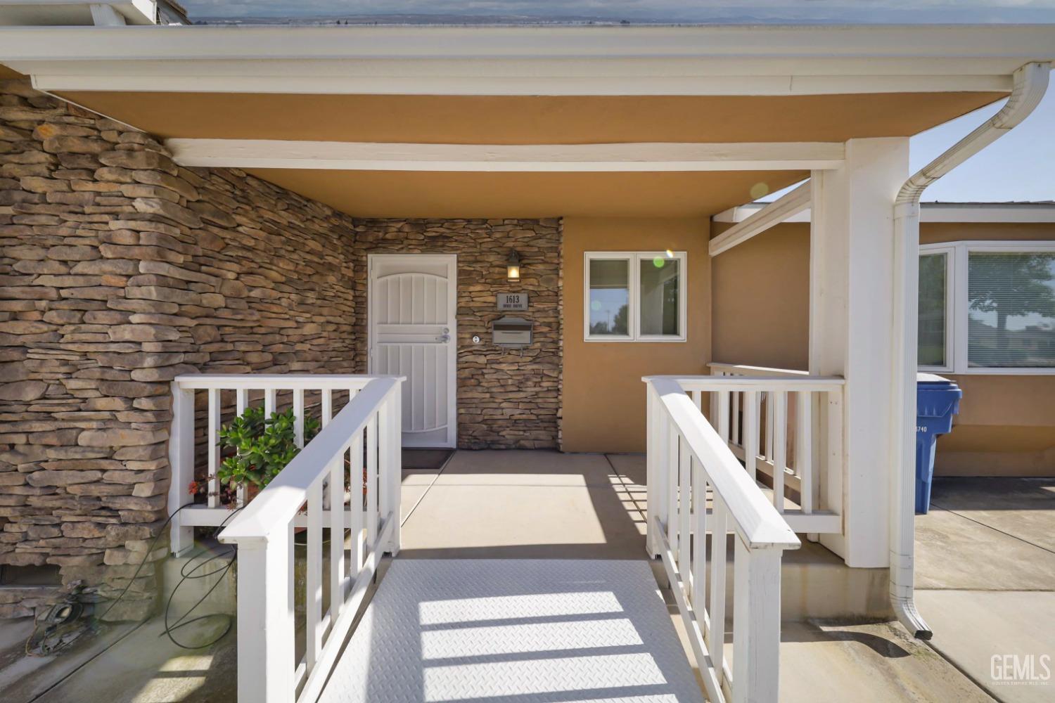 Undisclosed Address Bakersfield, CA 93305 - Photo 3 of 33 a view of staircase with wooden floor and fence