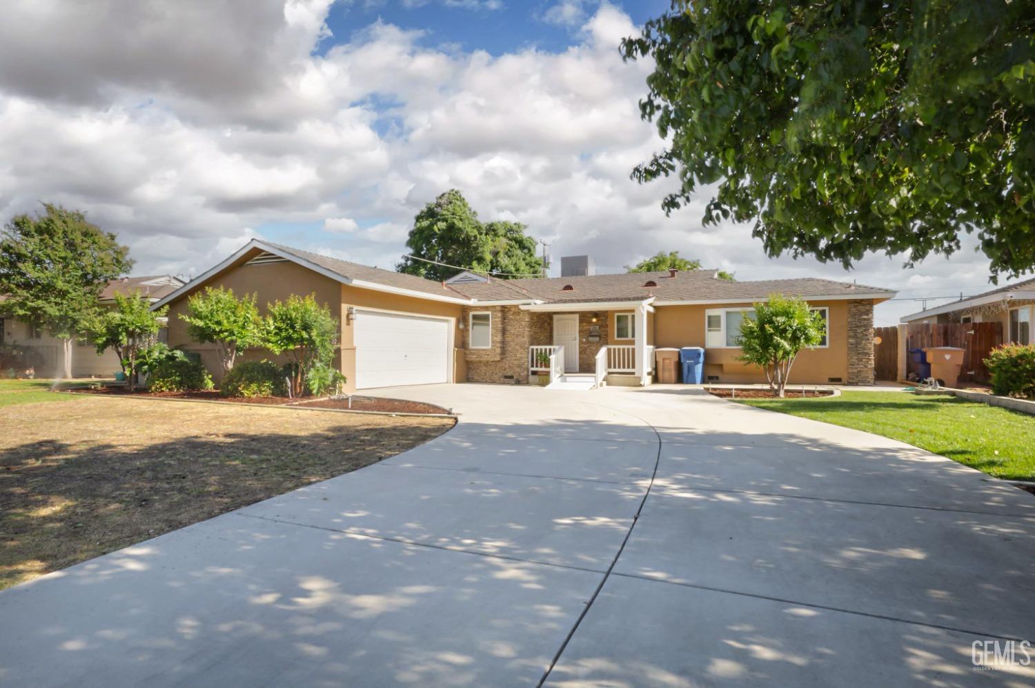 Undisclosed Address Bakersfield, CA 93305 - Photo 31 of 33 front view of a house with a yard