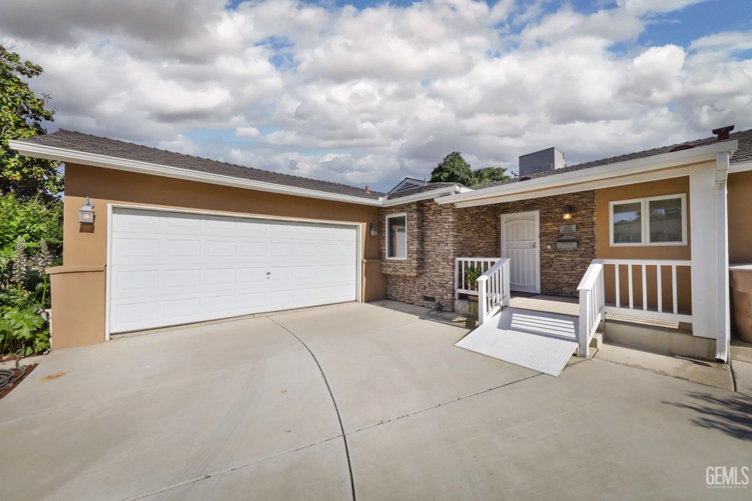 Undisclosed Address Bakersfield, CA 93305 - Photo 33 of 33 a view of a patio with table and chairs and potted plants