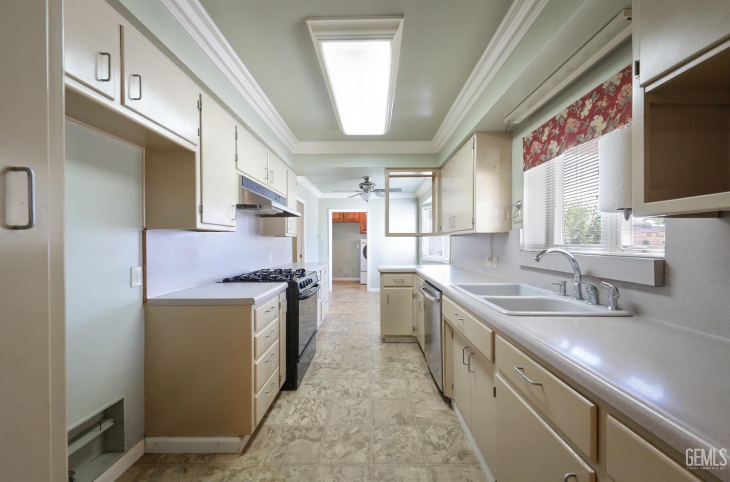 Undisclosed Address Bakersfield, CA 93305 - Photo 10 of 33 a kitchen with stainless steel appliances granite countertop a sink and a refrigerator