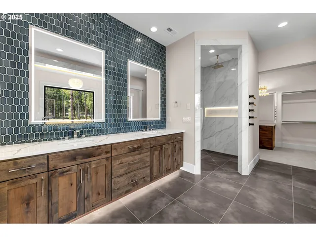 a bathroom with a double vanity sink and a mirror