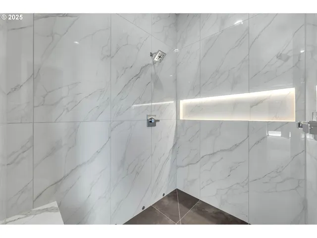 a picture of a bathroom with a shower