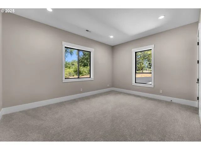 a bathroom with a double vanity sink and mirror