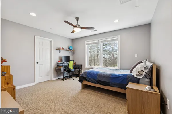 a bed room with a bed and a window