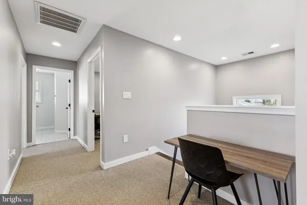 a workspace with furniture and window