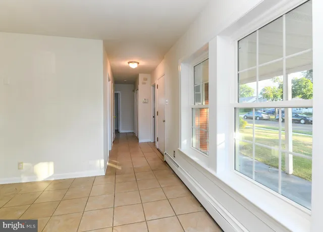 a view of a hallway with windows
