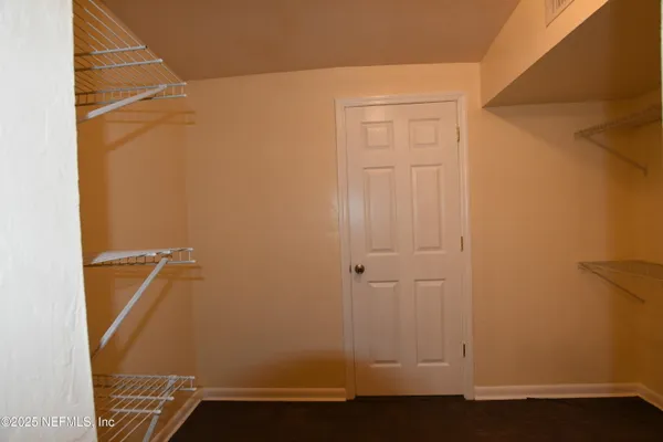 an empty room with wooden floor