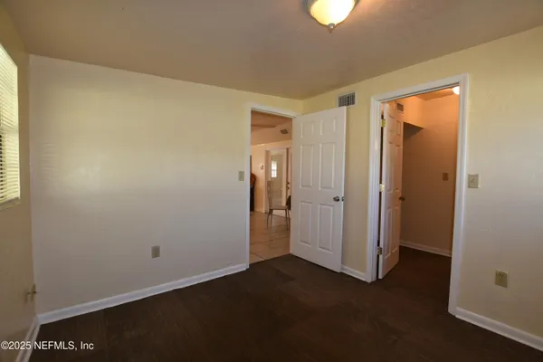 a lobby with furniture and a large window